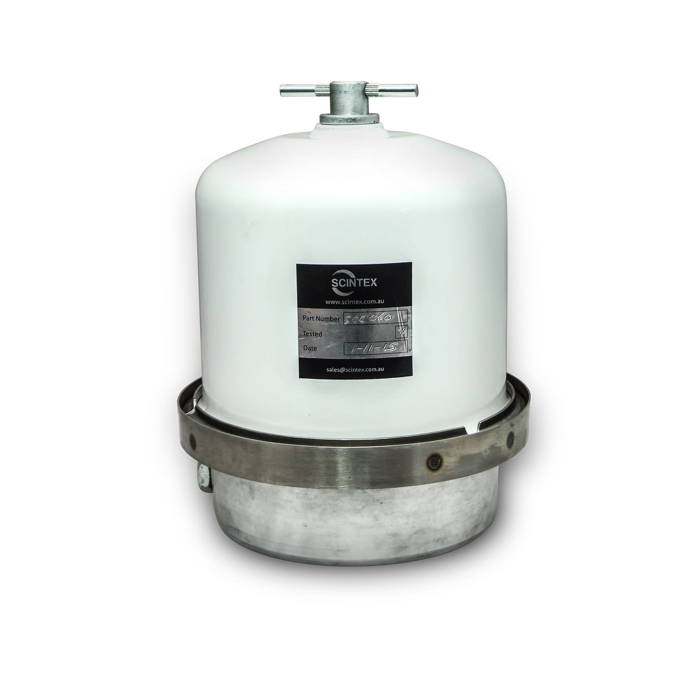 A white industrial filter vessel with a metal base and clamp, featuring a black label with product information on the front, isolated on a white background.