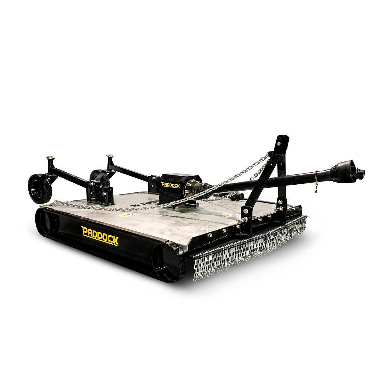 A heavy-duty Paddock slasher mower attachment with black metal frame, chains at the rear, and a silver cutting deck, designed for clearing brush and grass.