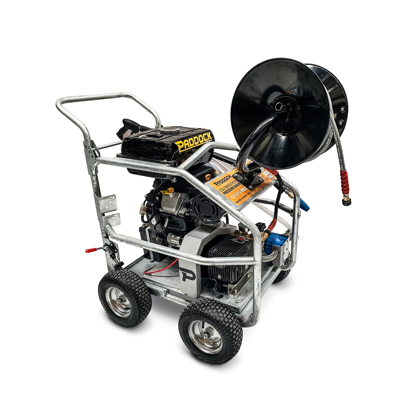 Heavy-duty portable pressure washer with metal frame, four wheels, a hose reel mounted on top, and “Paddock” branding, designed for industrial cleaning tasks.
