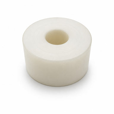 A large, clear roll of adhesive tape—evocative of the cylindrical precision found in a Scintex Manure Spreader Cam Roller Bush—is shown standing upright on a white background. The tape is unused, and its hollow center mirrors the clean engineering characteristic of this essential spare part.