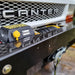 Close-up of a Sherpa 4x4 Black Edition ‘Stallion’ 25,000Lb Winch mounted on the front bumper of a white Canter truck, with a yellow hook and cable clearly visible.