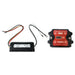 Two electronic devices are shown: the Trolltek™ DC/DC Charger & VSR Bundle by FREE SHIPPING, featuring a black programmable relay with attached wires and a red charger, both displayed on a white background.