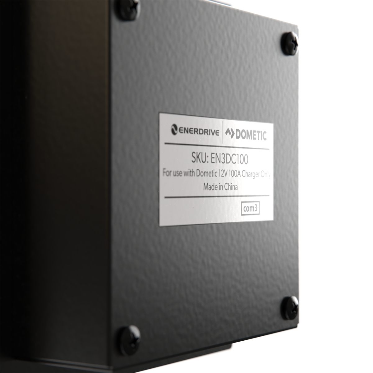 Close-up of a black Enerdrive DC2DC 100amp / 12v Battery Charger / MPPT Reg, SKU: EN3DC100, with a metal label. Features dual DC inputs for charging and solar MPPT. Brand: FREE SHIPPING. Secured by four screws; made in China.
