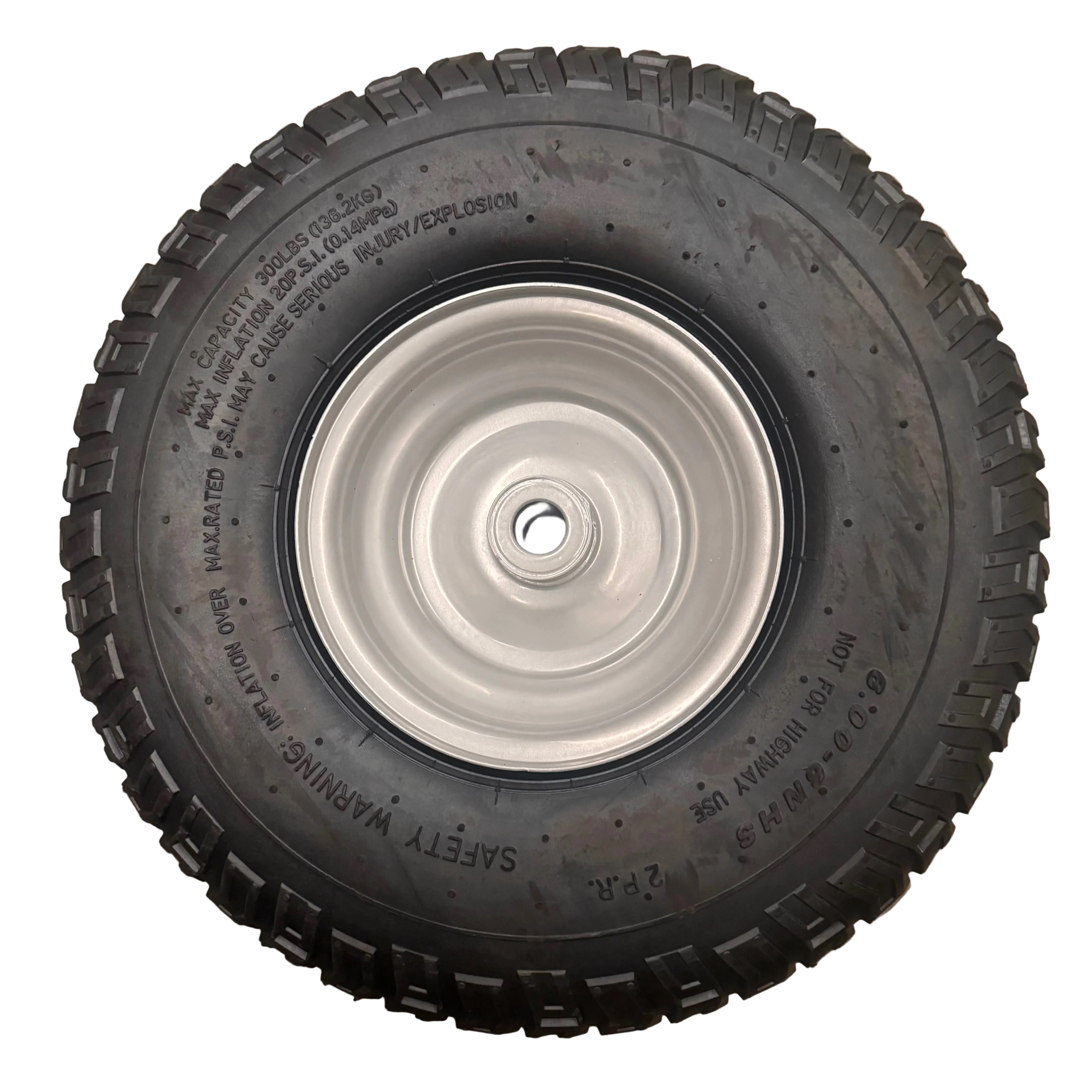 The Scintex Wheel - STBFS350, a black rubber replacement wheel with rugged tread and white metal rim, lies flat on concrete. Safety warnings and size info are printed on the sidewall, ideal for paddock fertiliser spreaders.