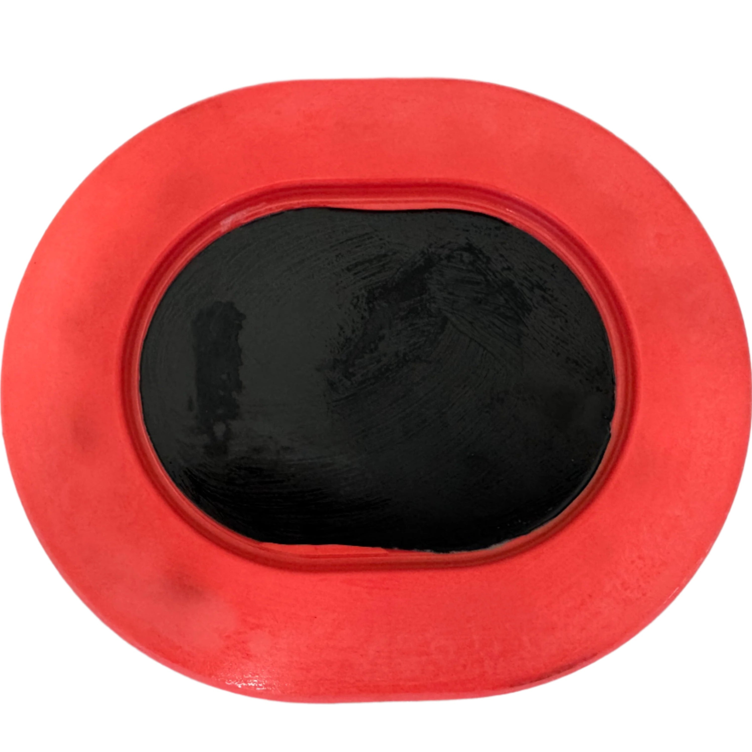 A bright red oval frame with a glossy black surface resembles a Paddocks Loncin Air Filter (SPTBFM04). The background features a textured, light gray fabric.