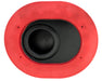 On a gray surface is a Paddock Loncin Air Filter, resembling the SPTBFM04 model. Its red and oval-shaped with a black circular center and small holes around its perimeter.