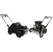 Two black lawn care machines with handles and visible engines, the Paddock Motorised Lawn Care Bundle features both a dethatcher and an aerator. Both have sturdy wheels, Paddock branding, and are designed for outdoor yard maintenance.