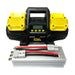 The Sherpa 4x4 'BIG V4' Air Compressor (400 L/min) with Pre-set Pressure Control, in yellow and black, sits behind a silver power inverter with red and black cables and connectors.