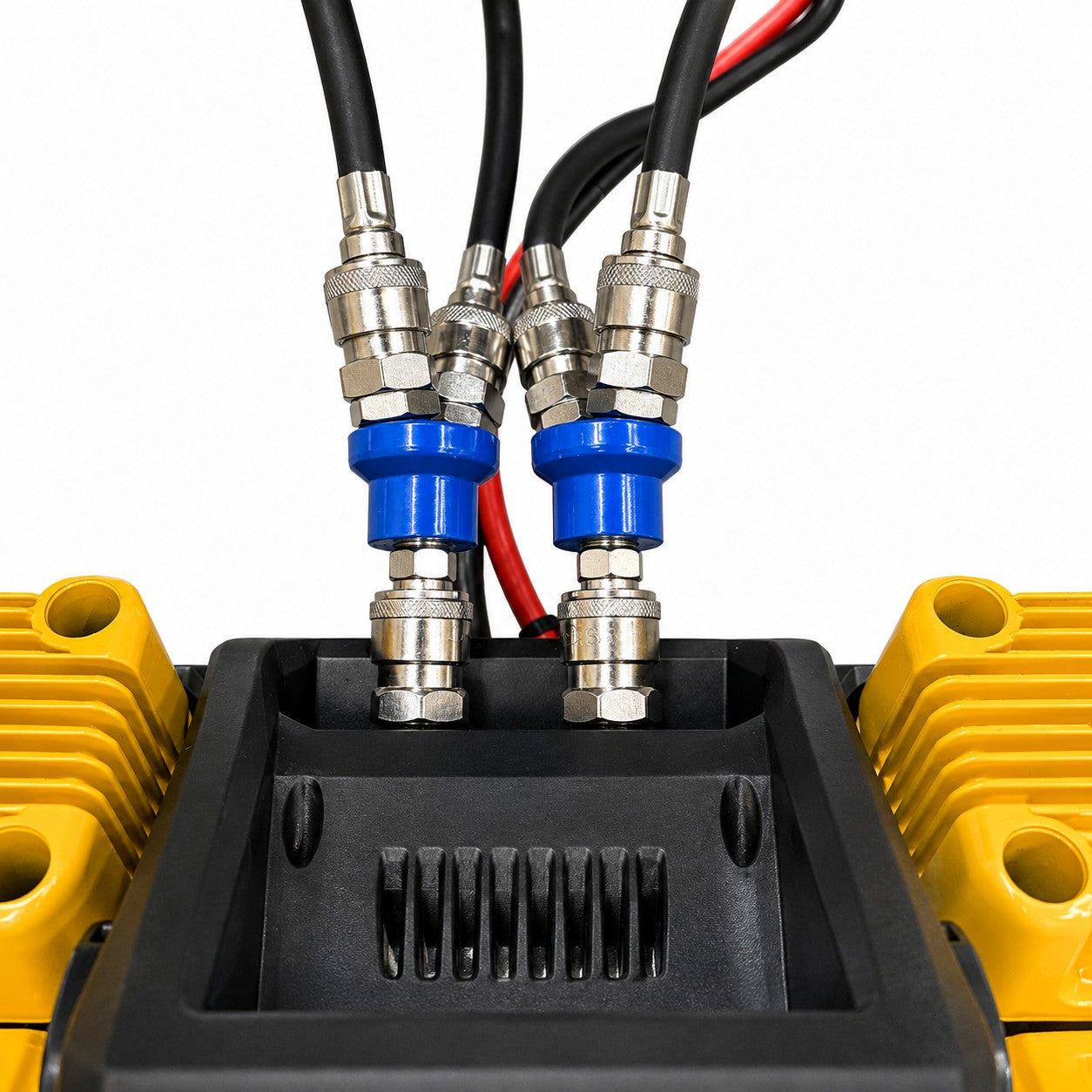 Close-up of two blue and silver industrial connectors fastened to thick black cables, mounted on a yellow and black mechanical unit with visible metal bolts and ridged components—featured as part of the Sherpa 4x4 ‘BIG V4’ Quad-Air Upgrade Kit – 4-Tyre Inflation System from Sherpa 4x4.