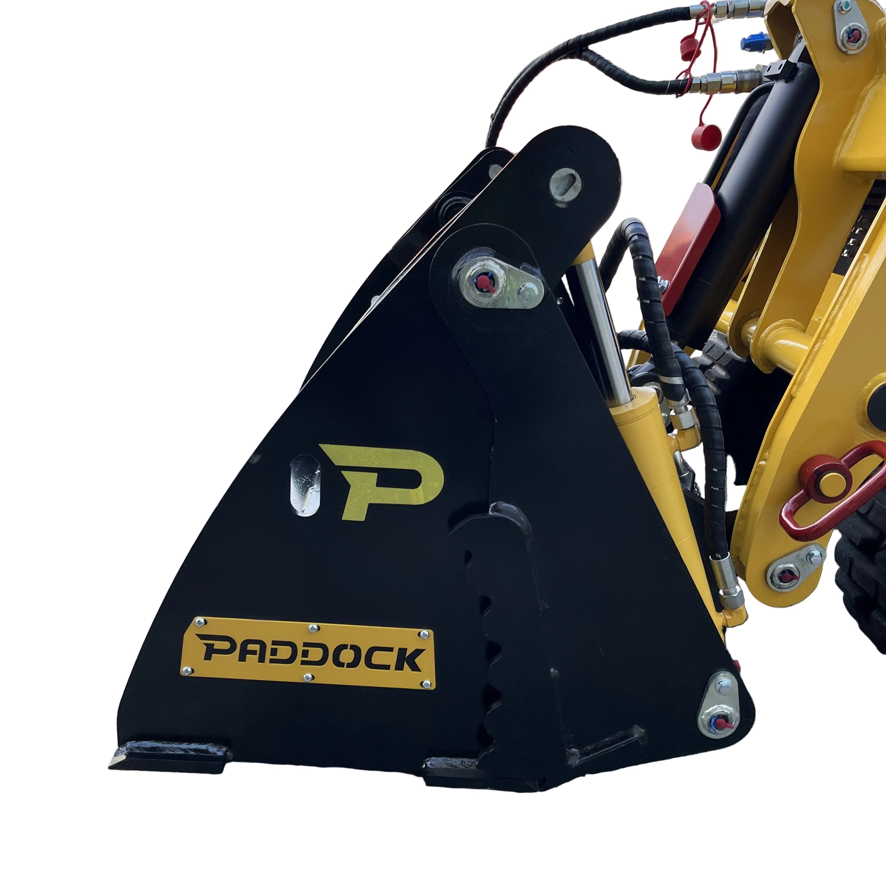 Close-up of a black and yellow Paddock-branded hydraulic attachment on heavy machinery, highlighting metal parts and hoses—designed for use with Paddock 4in1 Buckets and other compatible equipment.