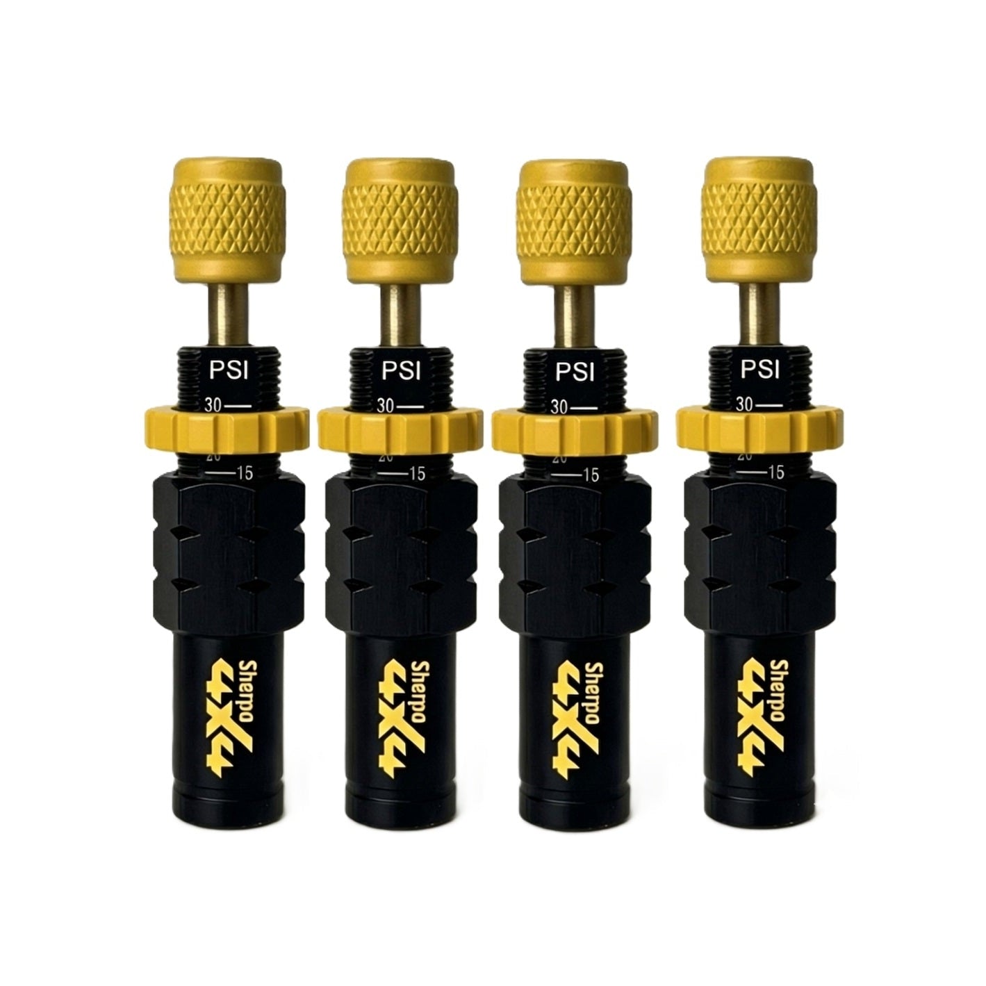 Four Sherpa 4x4 Tyre Deflators—black and gold, each showing "PSI" and 15–30 range—are lined up on a white background, offering fast, accurate air-down for any off-road trip. Set of four by Sherpa 4x4.