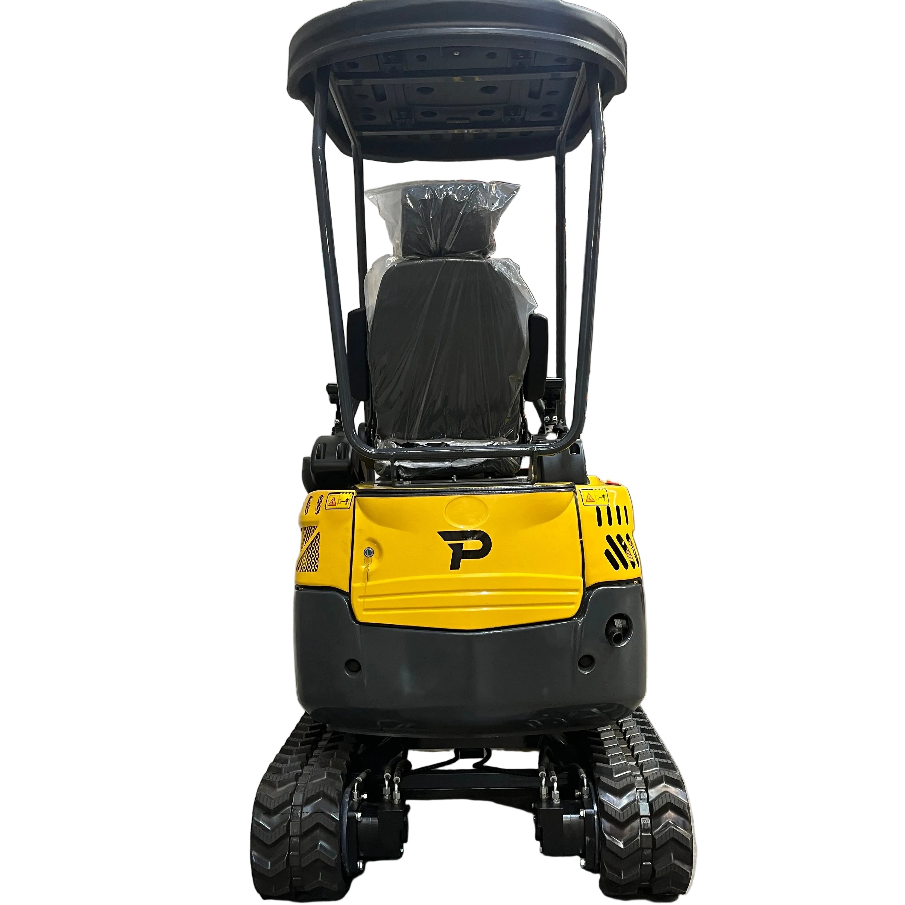 A Paddock Excavator Series 17 with 6 Attachments Bundle by Paddock, in yellow and black, is parked indoors on a concrete floor facing the camera, with industrial shelves stocked in the background.