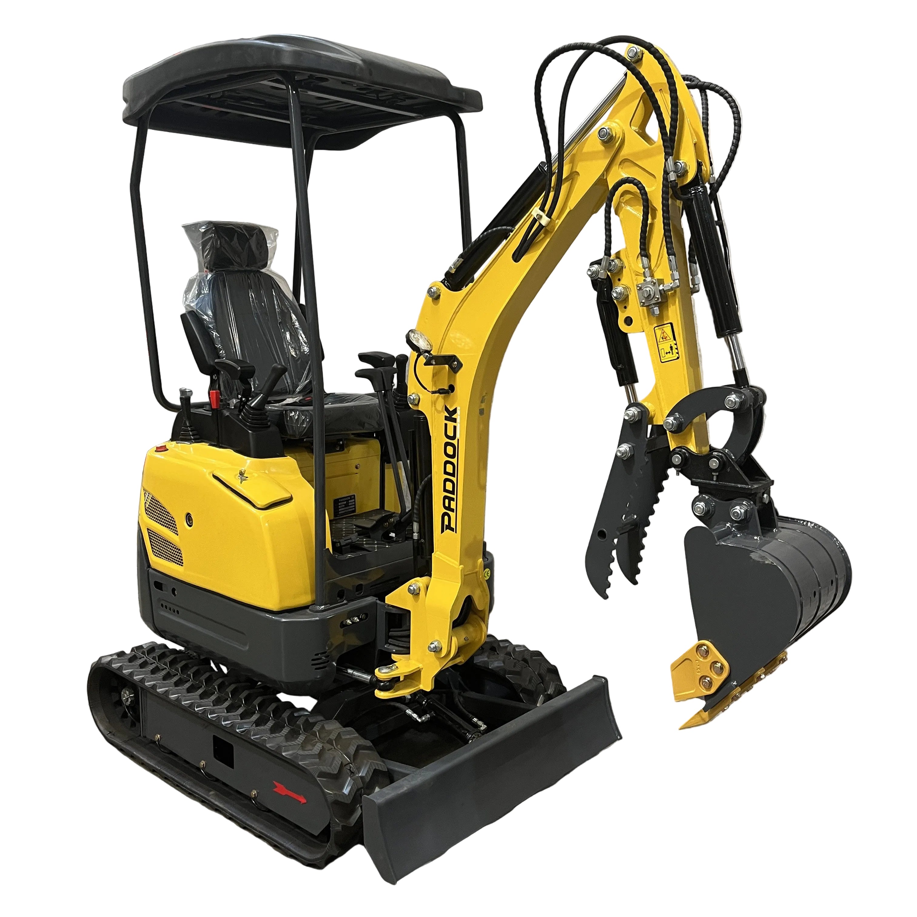 A Paddock Excavator Series 17 with a 6 Attachments Bundle is parked indoors on a concrete floor in front of a grey wall.