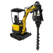 A yellow Paddock compact excavator fitted with a Paddock Excavator Auger Drive is parked indoors on a concrete floor near a gray wall. The clean machine is well-suited for trenching equipment needs and appears in good condition.
