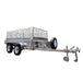 The Paddock Mini Loader & Excavator Alloy Equipment Trailer by Paddock features a silver double-axle design, metal mesh sides, front-mounted spare tire, and tow hitch—built tough like top Australian machinery trailers for reliable material transport.