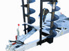 The Paddock Excavator 2.9T Trailer Auger Rack & Well Mount is a silver, Australian-made alloy trailer featuring two large auger drill bits in black holders near the hitch, heavy-duty components, and a sturdy wheel for reliable performance.