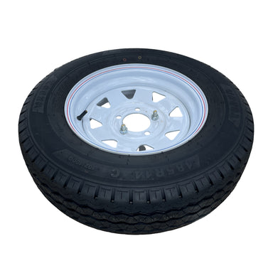 A black rubber tire with a white alloy rim, lying flat on a white background. Designed for Paddock Mini Loader & Excavator Alloy Equipment Trailers, it's ideal for heavy-duty use and features visible tread patterns and embossed markings.