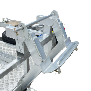 Close-up of a metal power head mount with auger holder, designed for secure equipment transport. The checkered aluminum frame is featured on Paddock’s Mini Loader Trailer Power Head Mount & 3x Auger Holder, built for durability.