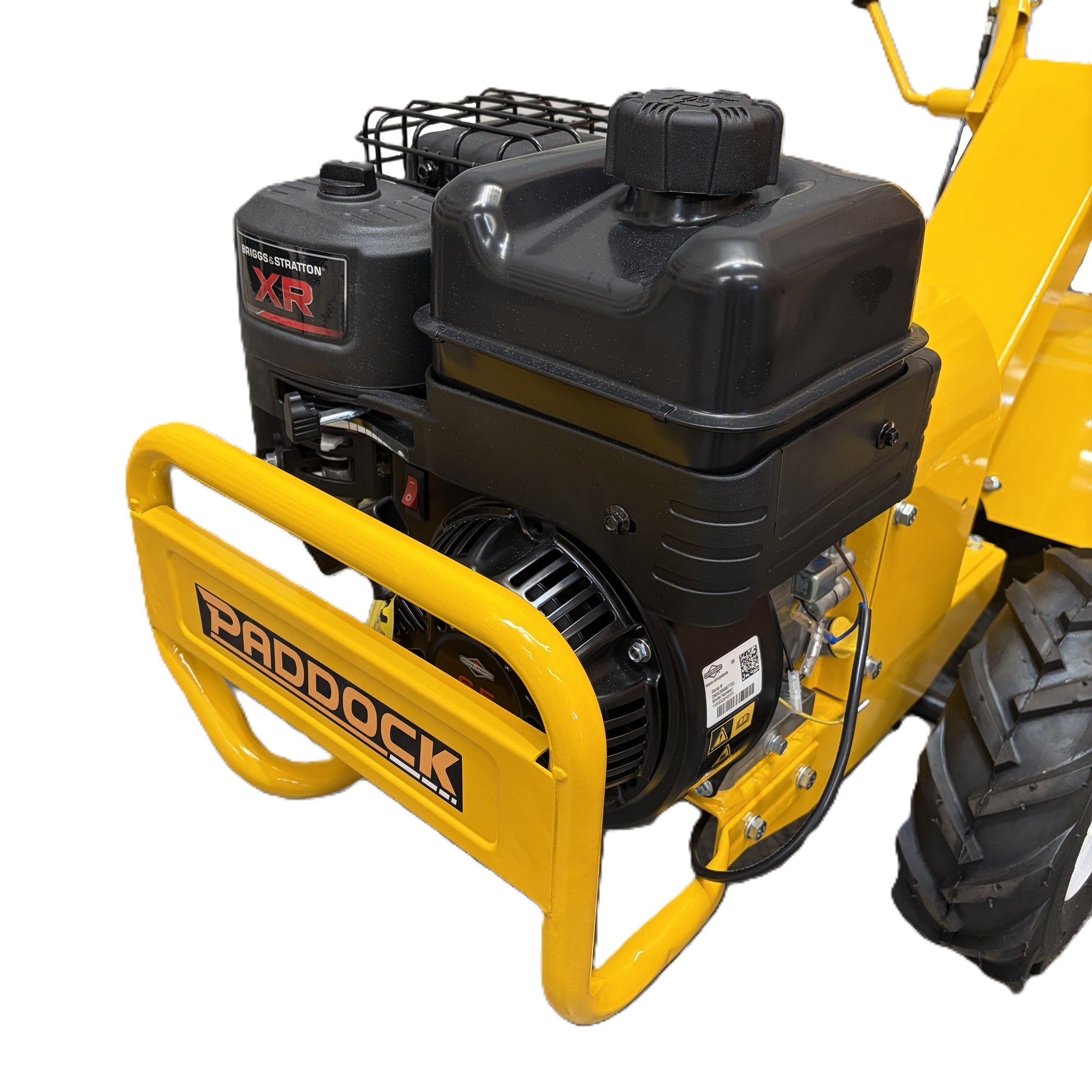 A yellow Paddock™ Walk Behind Rear Tine Tiller with a black Briggs & Stratton engine and a front bumper.