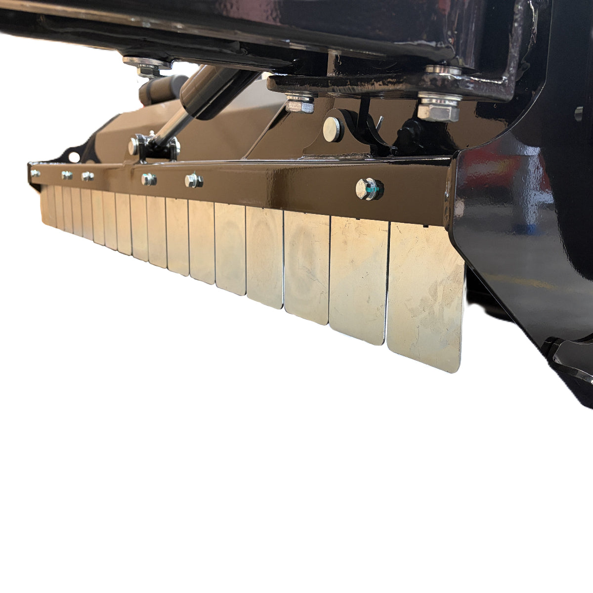 Close-up of a black metal component from the Paddock™ PTO Offset Verge Flail Mower by Paddock, featuring several shiny, rectangular metal plates attached in a row along the bottom edge and secured with bolts. White background.