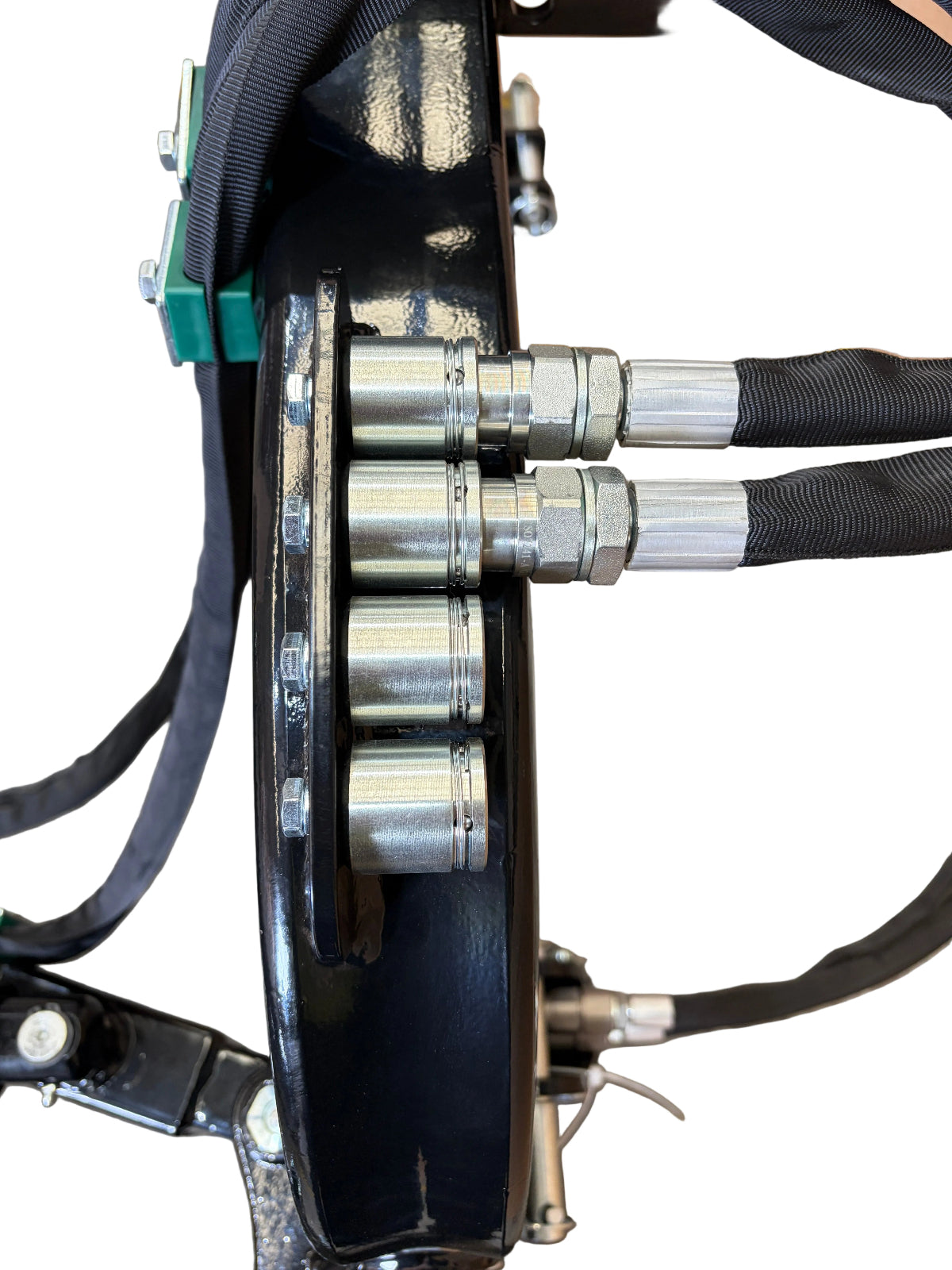 Close-up of four metal hydraulic hose fittings attached to a black mechanical component, with hoses encased in black protective sleeves, set against a white background—highlighting the robust construction characteristic of the Paddock™ PTO Offset Verge Flail Mower by Paddock, engineered for reliable performance with your tractor mower.