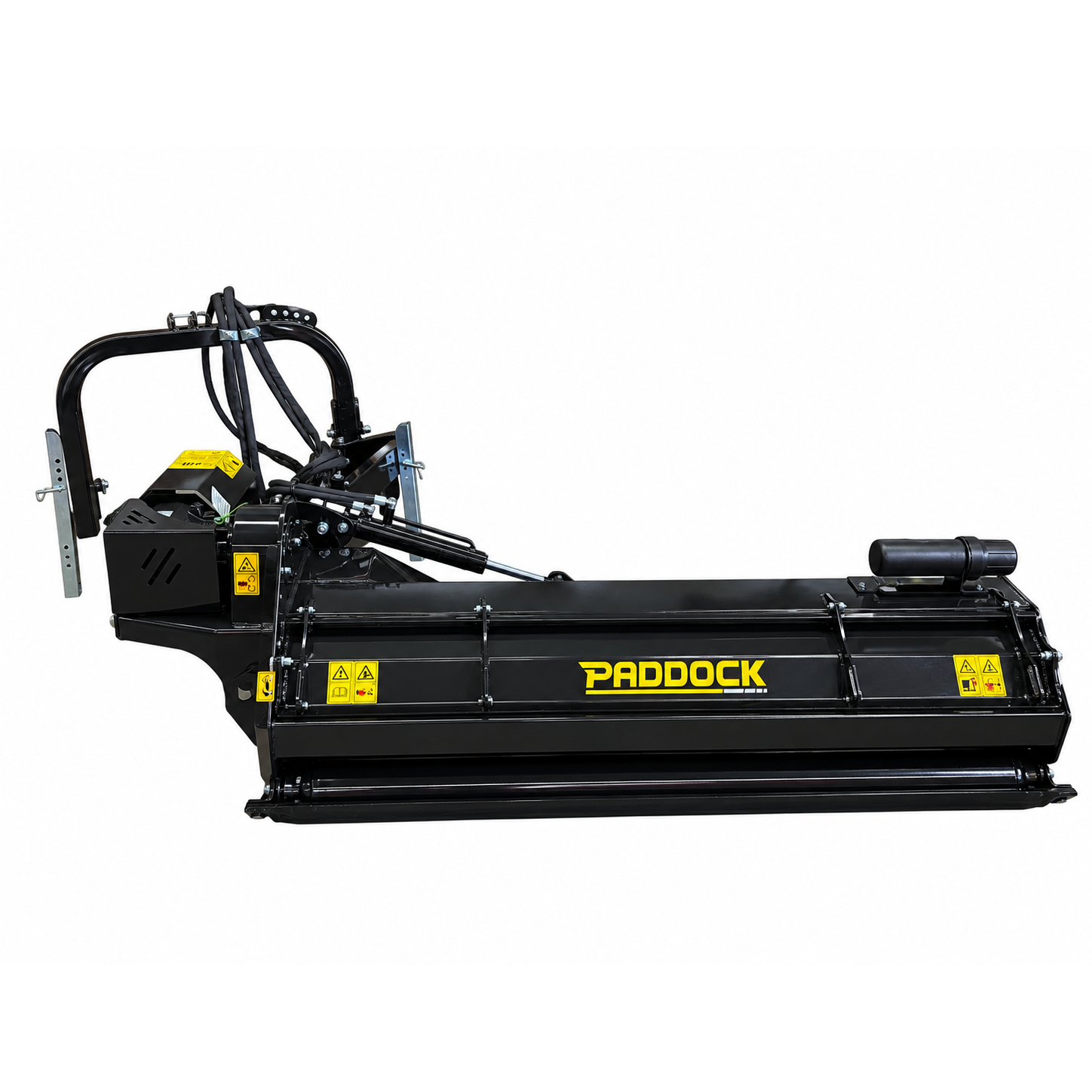 A black Paddock™ PTO Offset Verge Flail Mower with visible hydraulic hoses and warning labels, designed for use with heavy machinery such as tractors or skid steers. This heavy-duty attachment from Paddock features a hydraulic side shift for enhanced versatility, making it ideal for demanding mowing tasks on large properties or roadside verges.