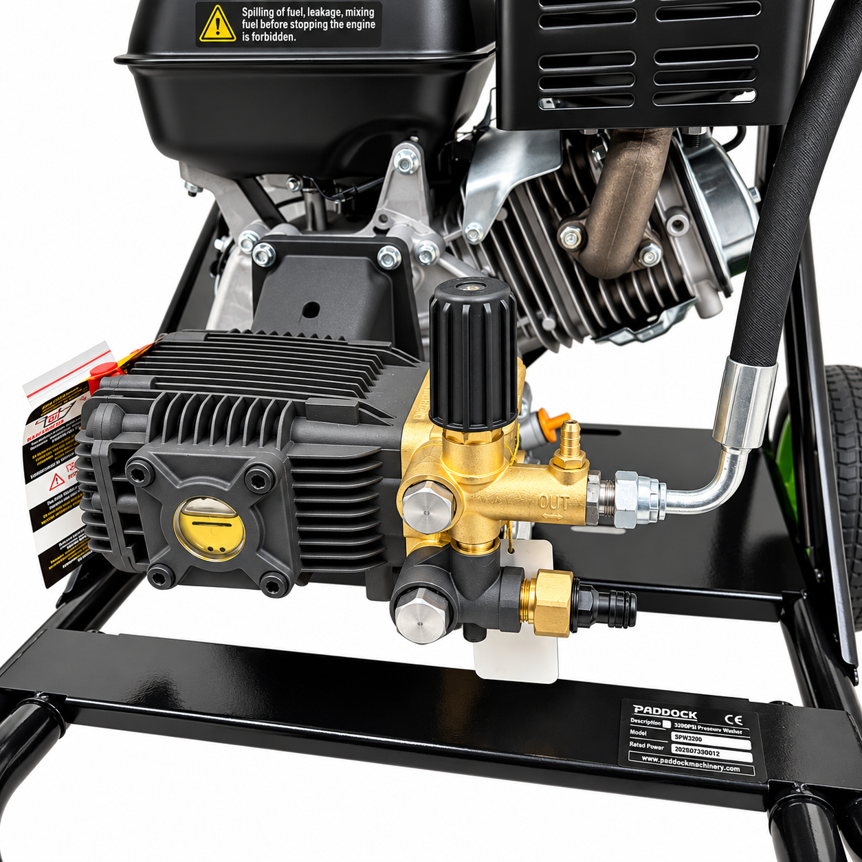 A close-up of a Paddock™ 3,200 PSI Cold Water Pressure Washer pump featuring a black ribbed engine component, a brass pressure control valve with an outlet port, and a manufacturer label on the frame.