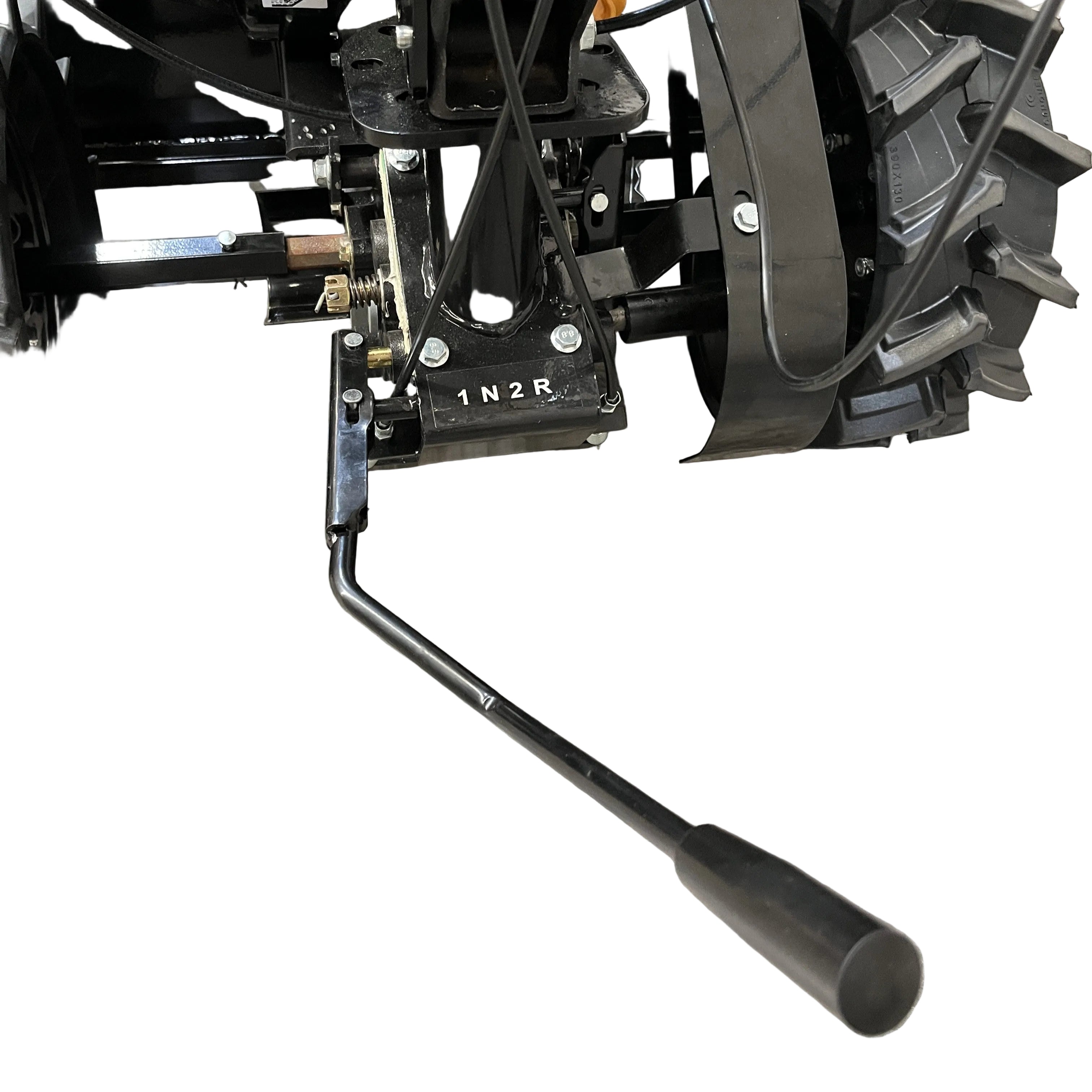 Close-up of a black metal gear shift lever near the rear wheel of the Paddock Walk Behind Flail Mower 12HP - 900mm, labeled with gear positions 1, N, 2, and R. The mower is by Paddock and shown against a white background.