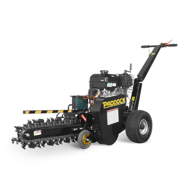 The Paddock Walk Behind Trencher with Guide Wheel is a portable black trencher by Paddock, featuring large rear wheels, a front digging chain, handlebar controls, and is ideal for easily cutting narrow trenches in the ground.