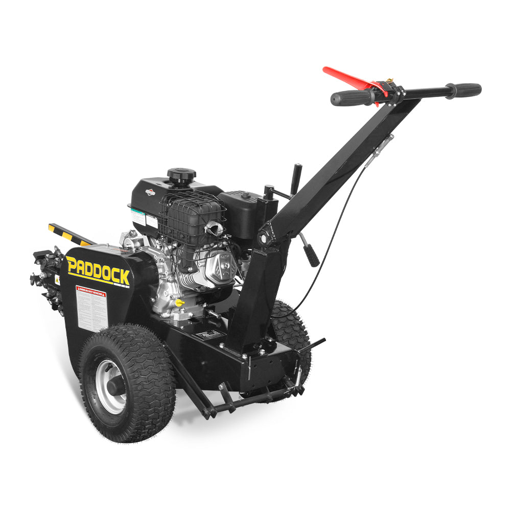 The Paddock Walk Behind Trencher with Guide Wheel features large rugged tires, a powerful Briggs & Stratton engine, and a long handle with red grip—delivering performance similar to a stump grinder for tough digging tasks.