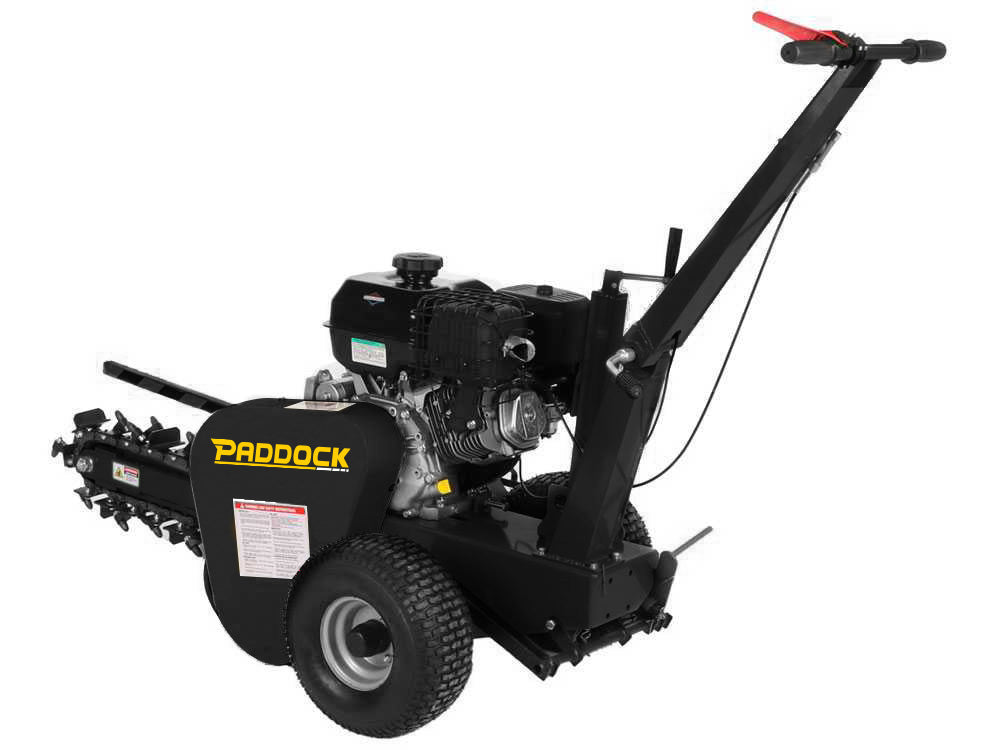 A black Paddock Walk Behind Trencher with Guide Wheel features large rear wheels, control handles, a Briggs & Stratton engine, and a side-mounted rotating chain trencher attachment.