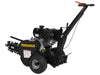 A black Paddock Walk Behind Trencher with Guide Wheel features large rear wheels, control handles, a Briggs & Stratton engine, and a side-mounted rotating chain trencher attachment.