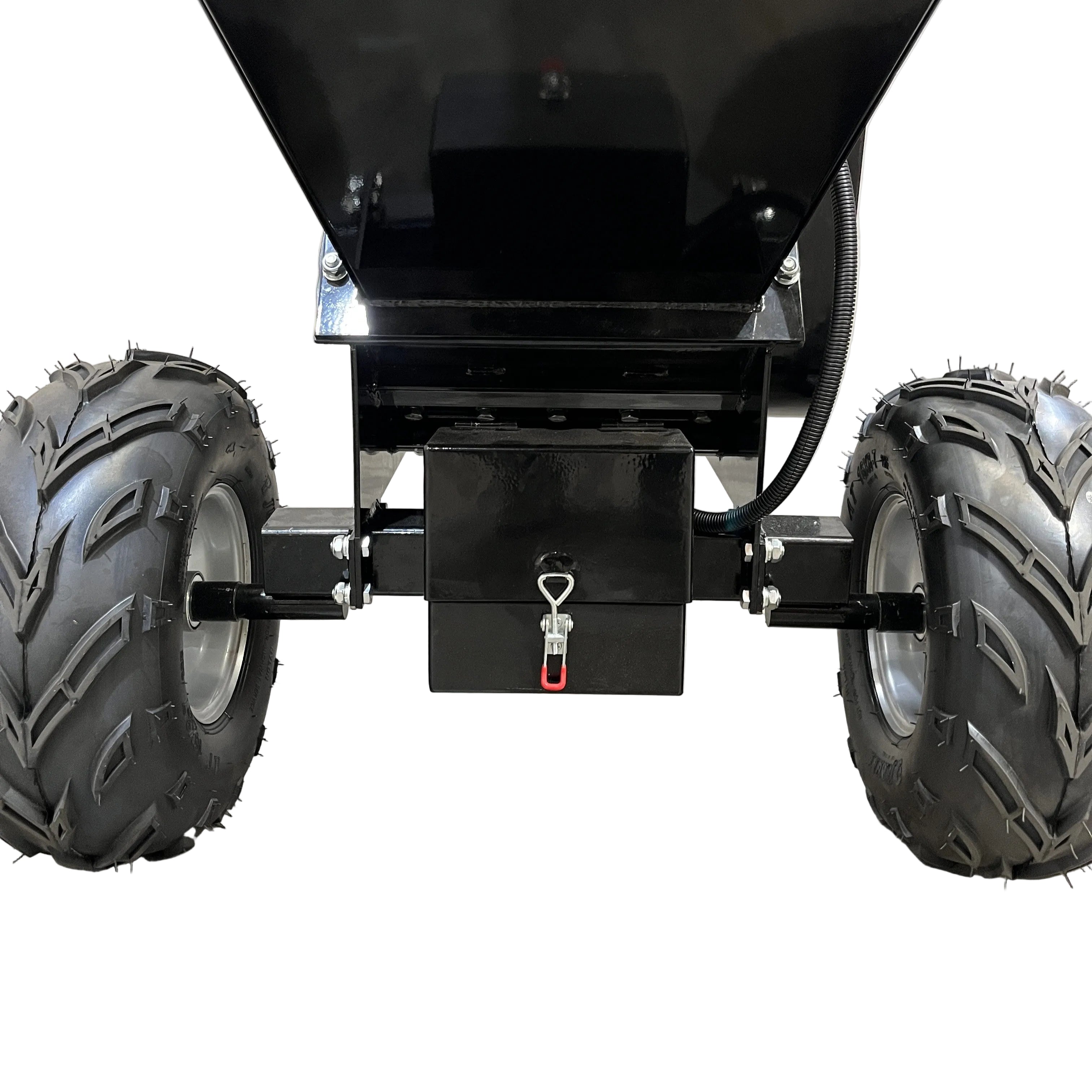 Close-up of the Paddock Wood Chipper Mulcher’s rear wheels and undercarriage by Paddock, featuring thick treaded tires and a black box with a red-handled pin, highlighting its sturdy build for demanding tasks.