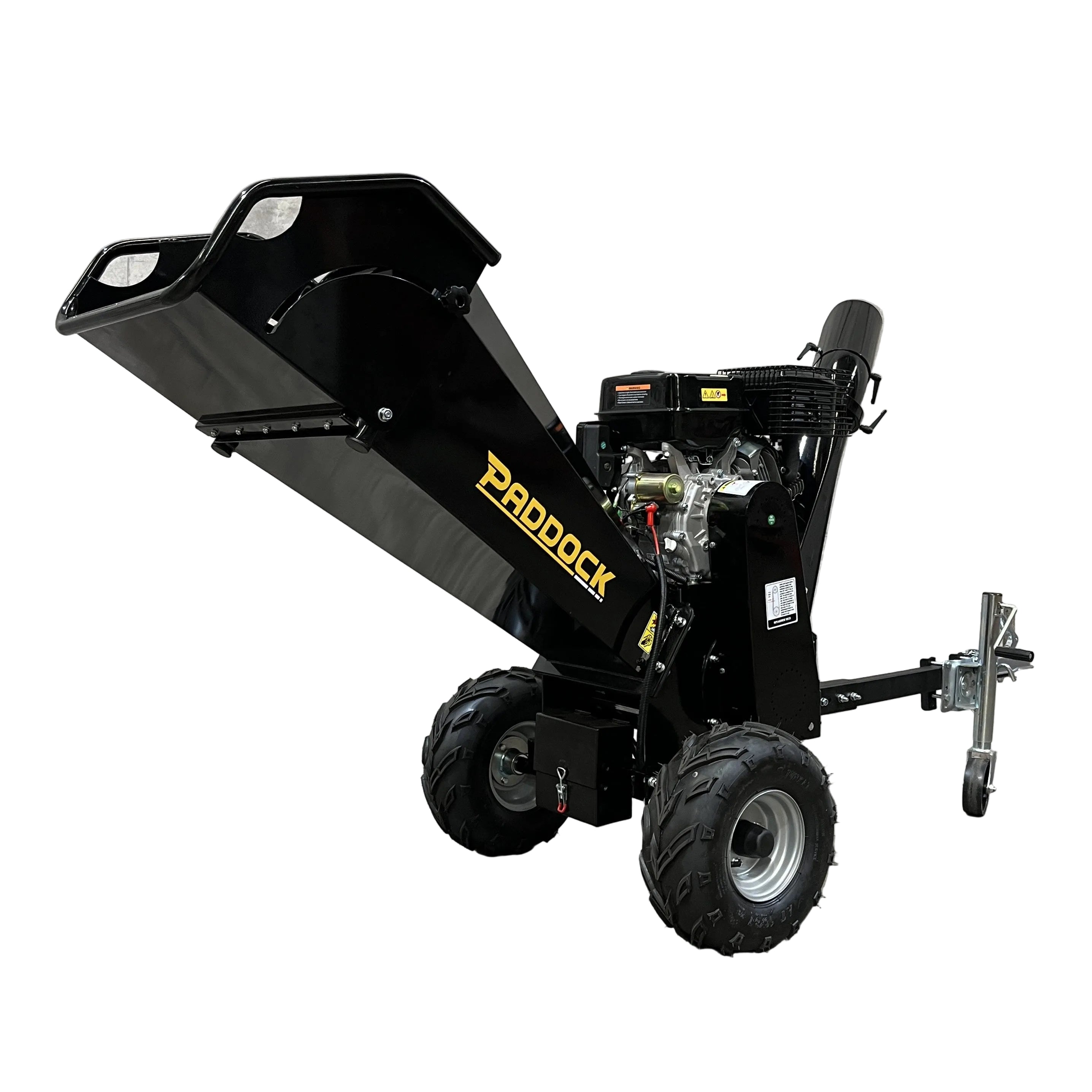 The Paddock Wood Chipper Mulcher, featuring a sturdy metal frame and large black wheels, is pictured on a concrete floor against a bare, textured wall.