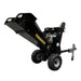 The Paddock Wood Chipper Mulcher, featuring a sturdy metal frame and large black wheels, is pictured on a concrete floor against a bare, textured wall.