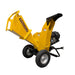 Yellow Paddock™ Wood Chipper Shredder 75mm with a 6.5hp Kohler engine, featuring a large intake chute and a petrol engine mounted on two wheels.