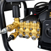 Close-up of the brass pump head assembly for a Paddock™ 1,450 PSI Wall Mountable Pressure Washer, showing hose connections and an on-off switch.