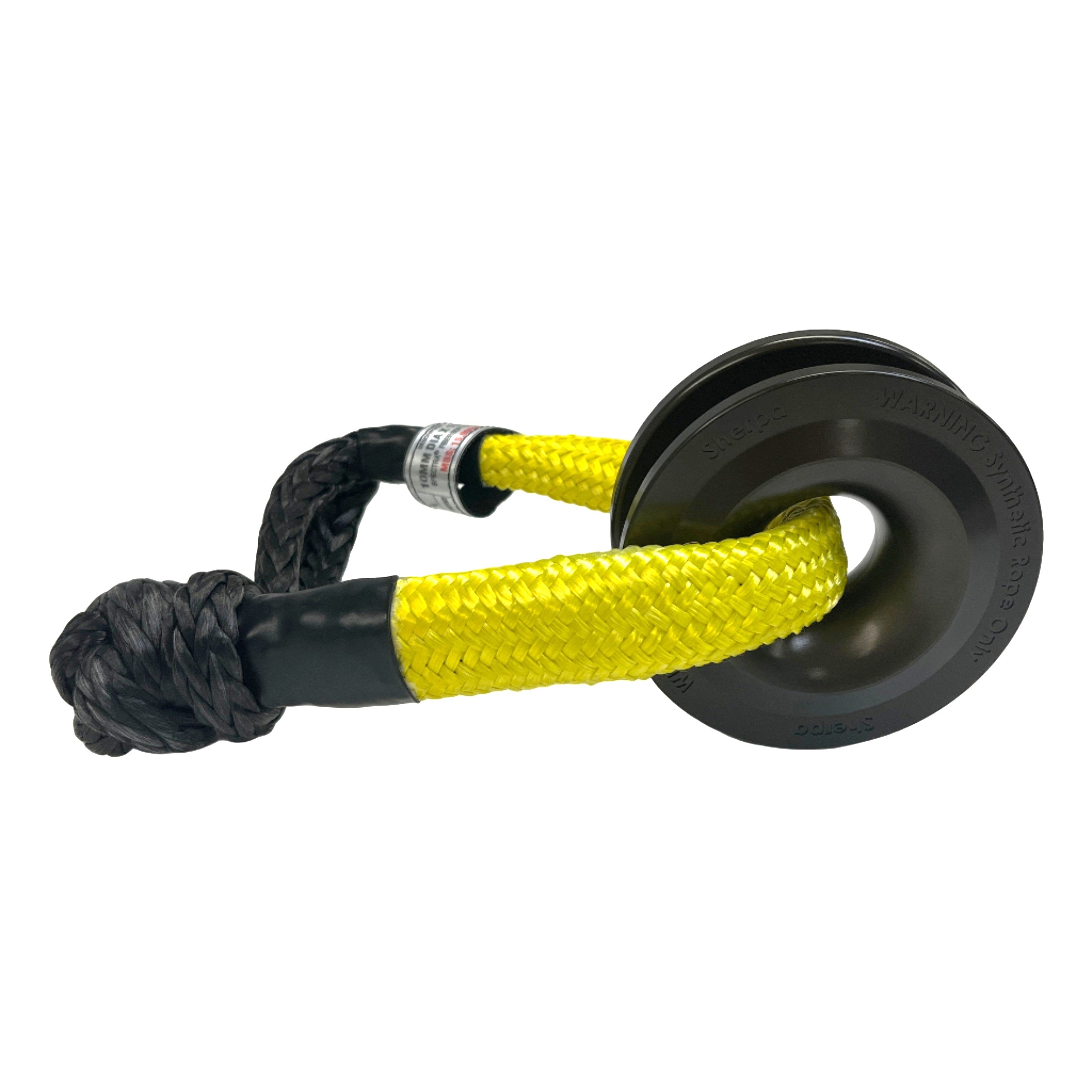 The Sherpa 4x4 Recovery Ring & Soft Shackle Bundle by Sherpa 4x4 features a durable black and yellow synthetic soft shackle paired with a recovery ring, ideal for off-road vehicle recovery and towing.