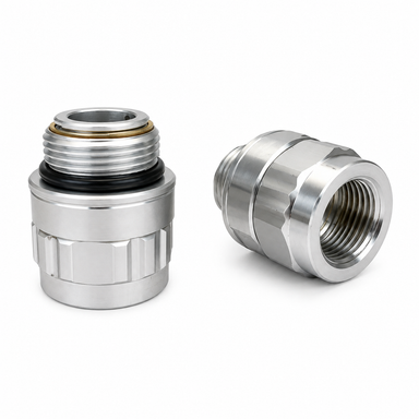 Two Scintex Swivel Fittings with threaded ends and rubber seals are displayed against a white background. One fitting stands upright to show its opening, while the other lies on its side, exposing the threaded interior. These metal pipe connectors are available in 3/4″ BSP and 1″ BSP sizes, providing secure and versatile solutions for plumbing installations.