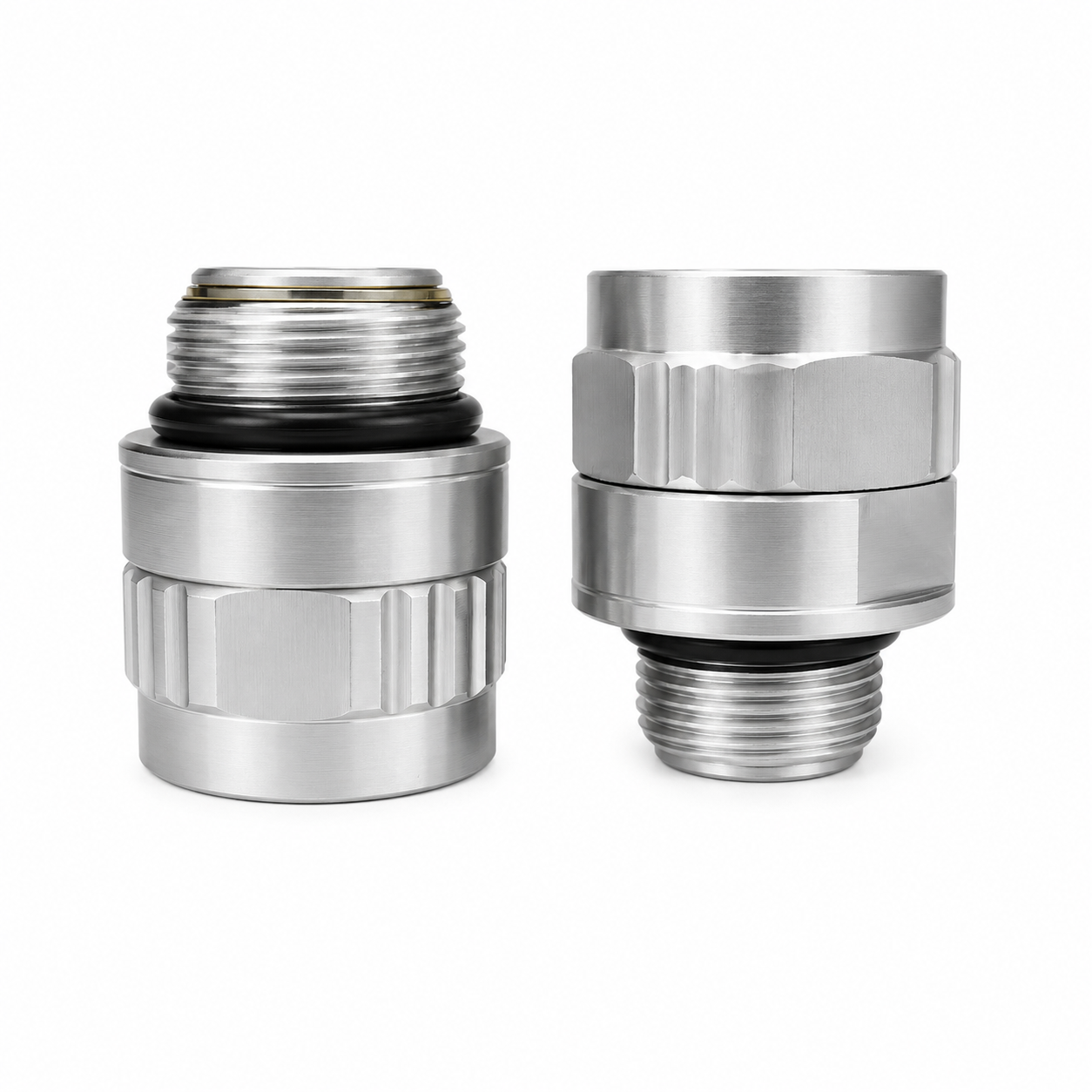 Two silver-colored Scintex Swivel Fittings made of metal, featuring threaded ends and knurled grips, are standing upright on a white background. Each fitting is designed with a BSP swivel fitting for compatibility with 3/4″ BSP and 1″ BSP connections.