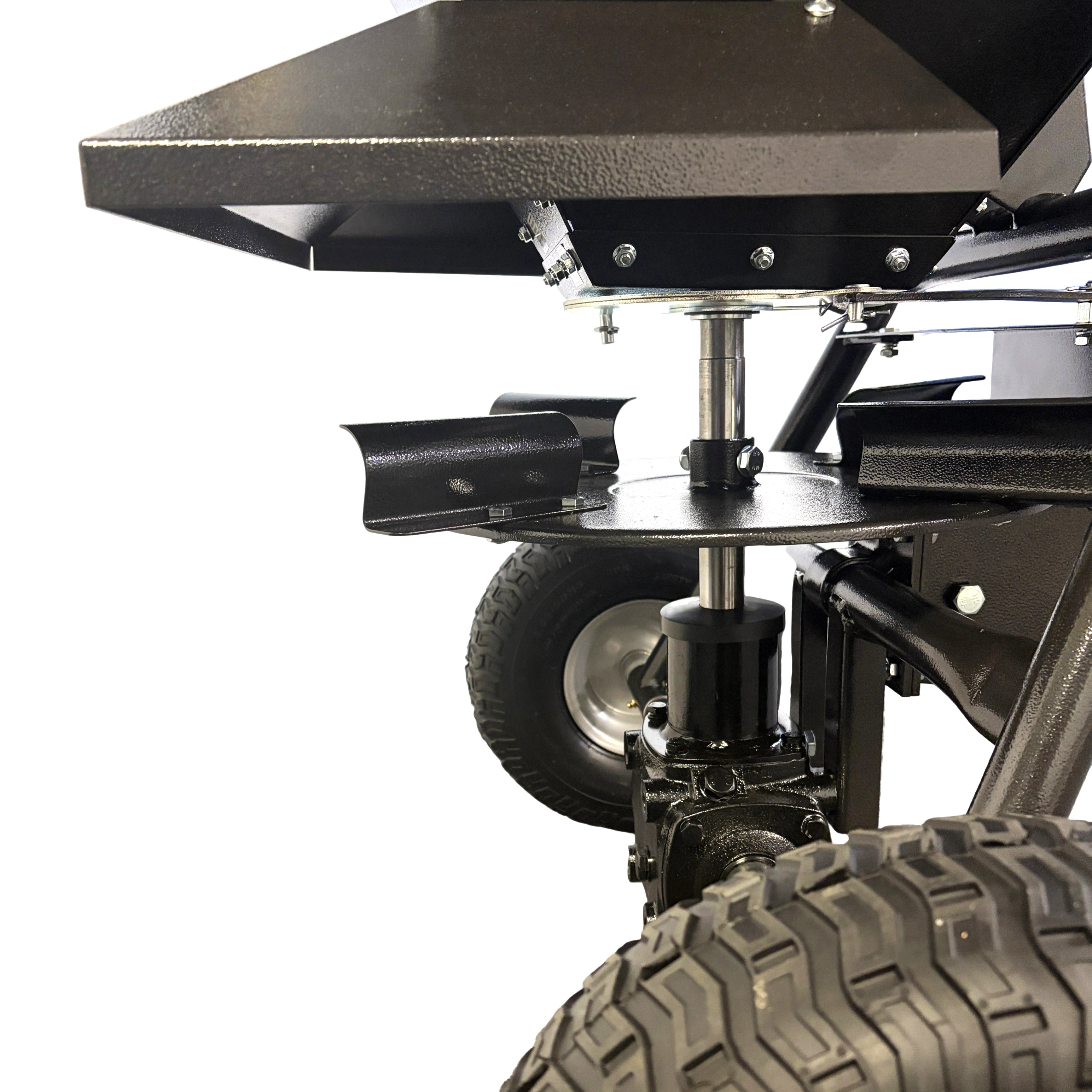 Close-up of a Paddock Seed & Fertiliser Spreader (Heavy Duty) showing the hopper, spreading disc, and pneumatic tires.