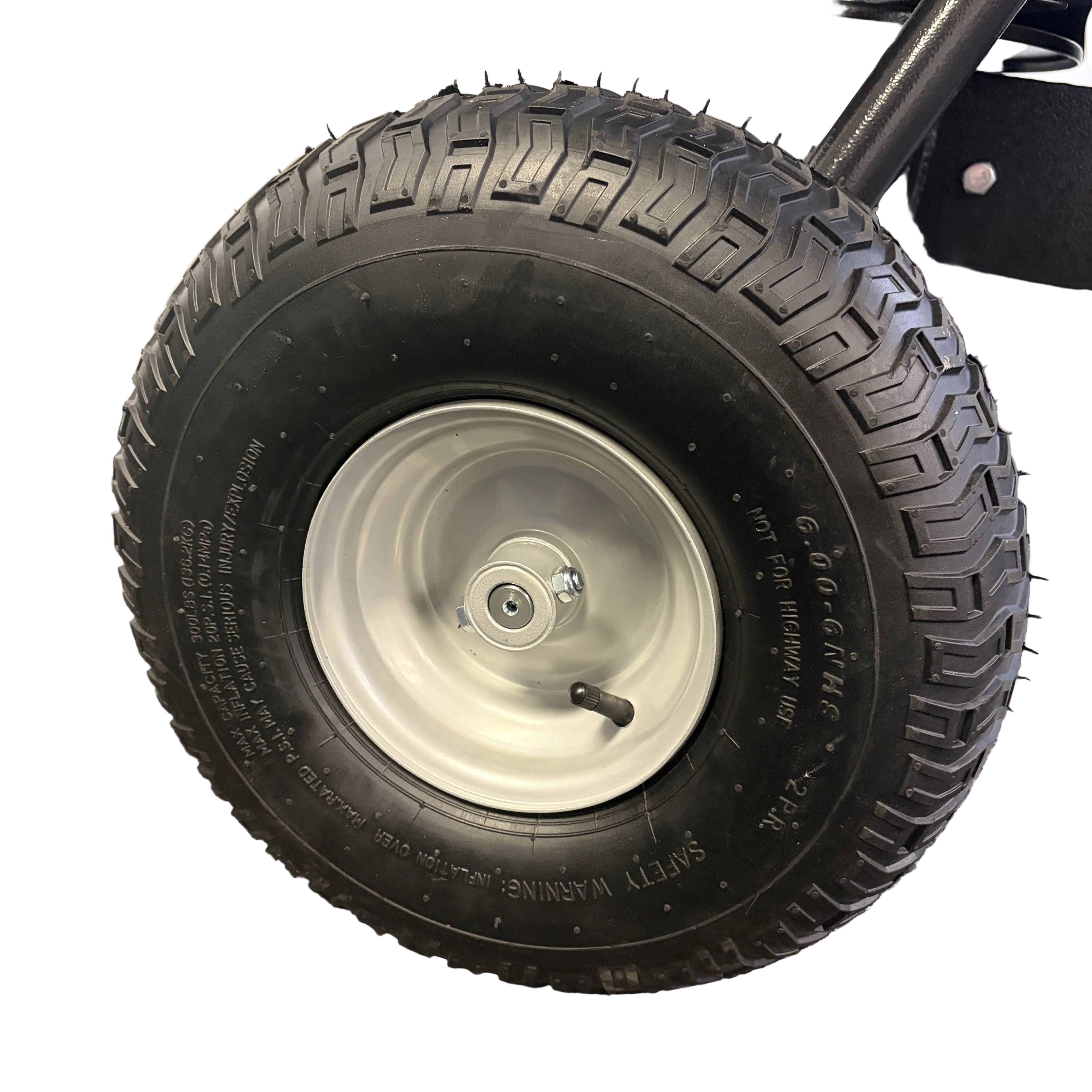 Paddock Seed & Fertiliser Spreader (Heavy Duty) pneumatic tire with a heavy-duty tread pattern on a light-colored metal rim.