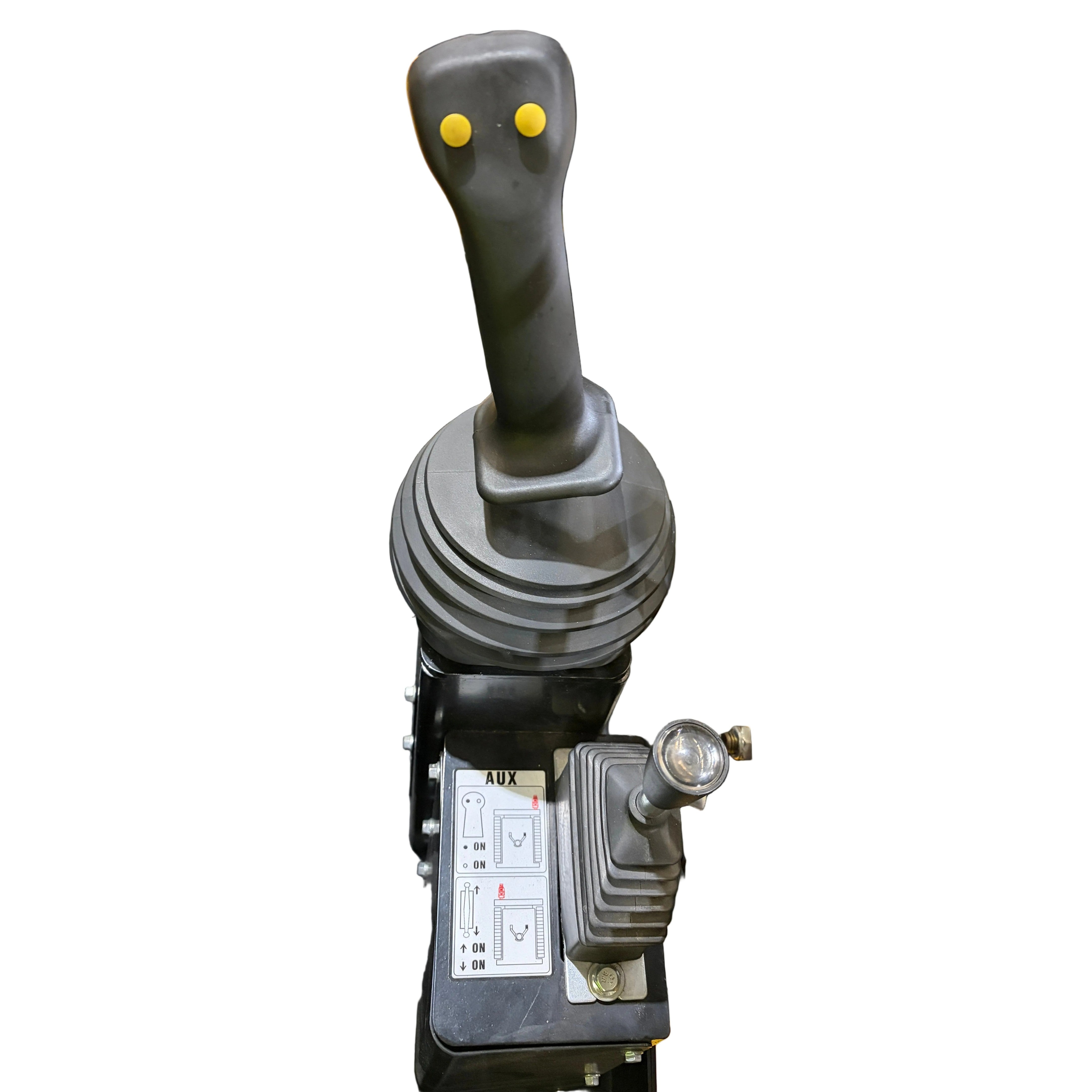 A close-up of the Paddock Tracked Cabin Loader Pro joystick showing two yellow buttons, a smaller lever, and an instruction panel with diagrams—features from this 40hp Perkins Turbo Diesel ex-demo model—isolated on a white background.