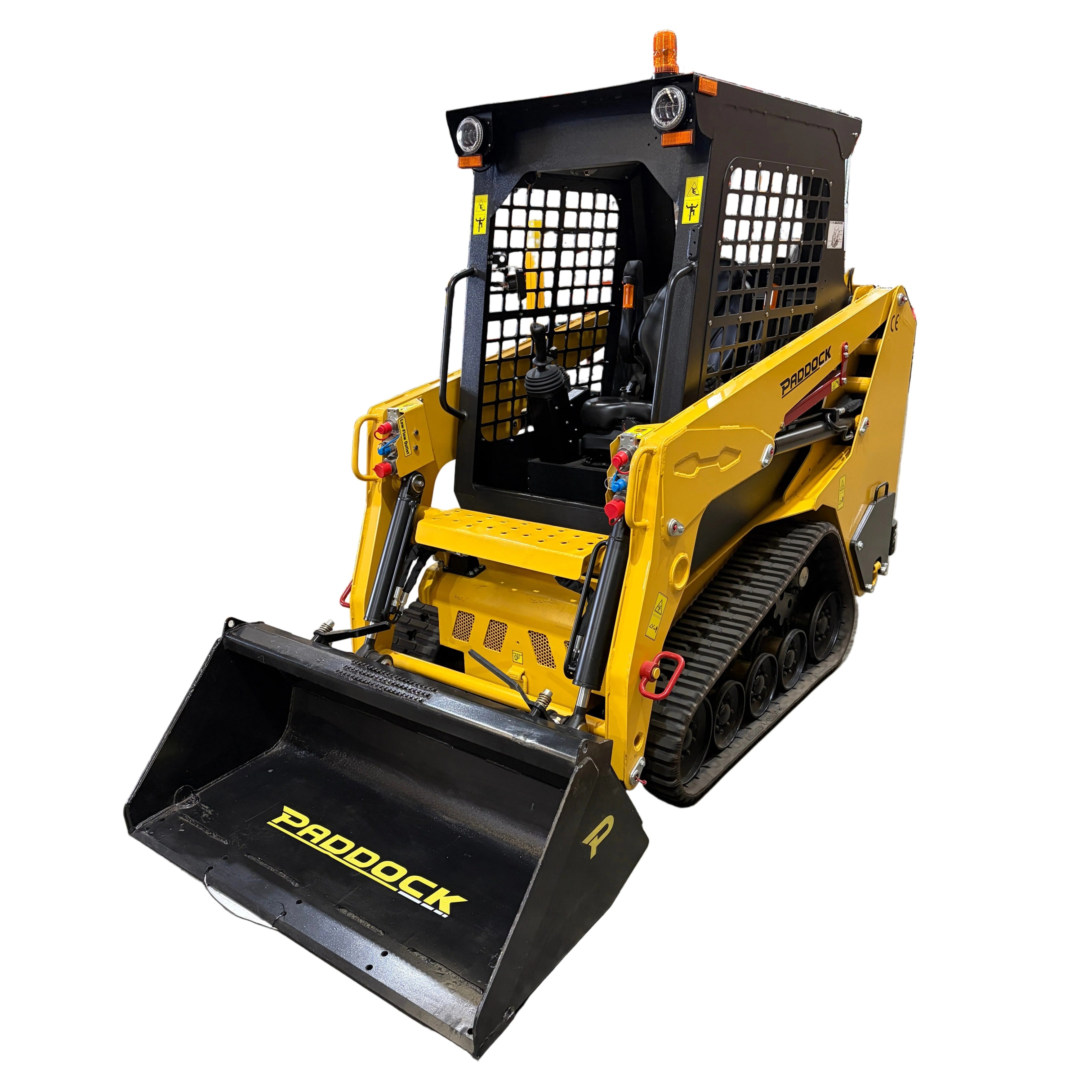 The Paddock Tracked Cabin Loader Pro, featuring a 40hp Perkins turbo diesel engine and protective cab, is shown with a front bucket attachment on a white background—ideal construction equipment for tough jobs.