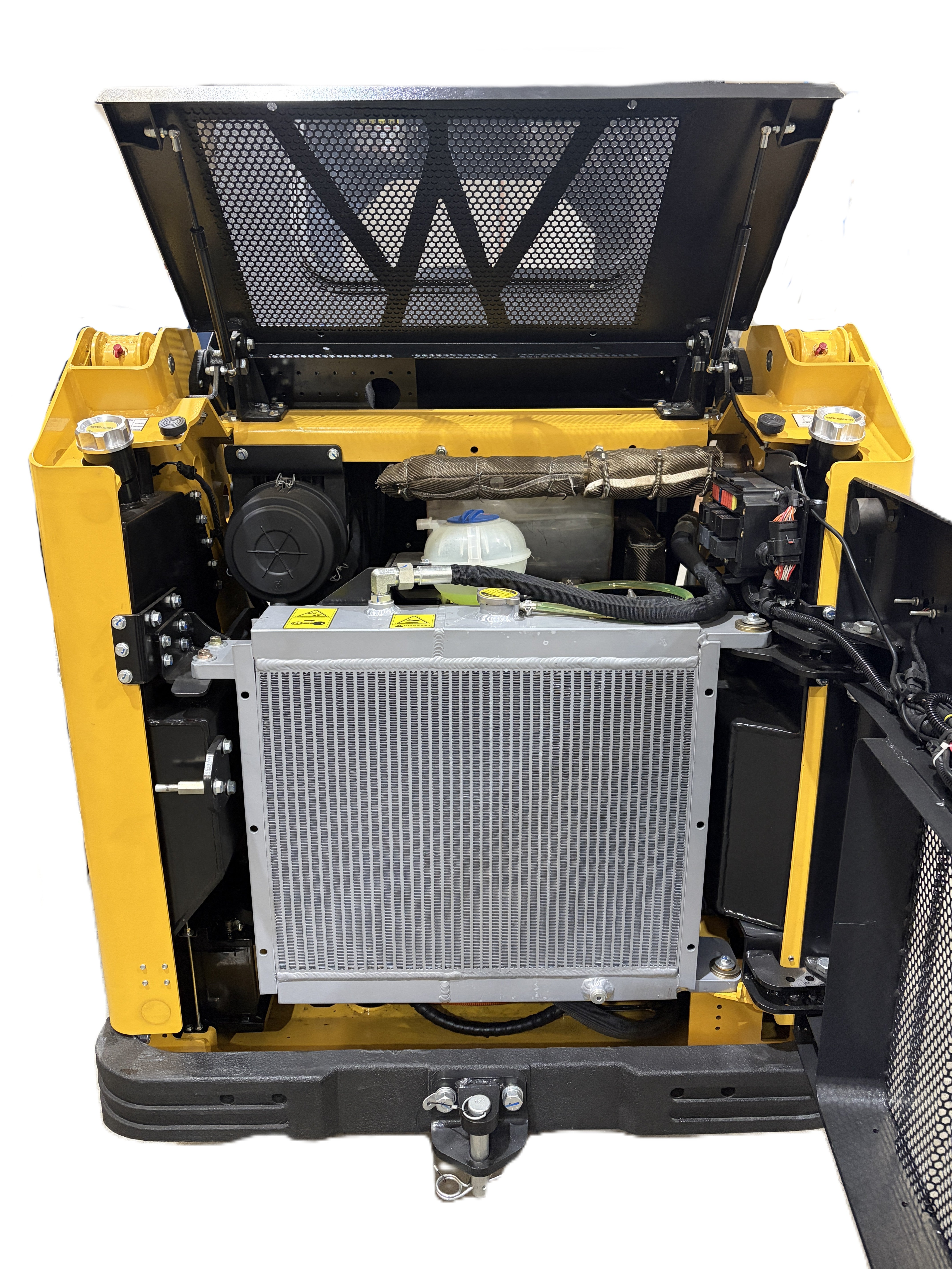 The image displays the open engine compartment of a Paddock Tracked Cabin Loader Pro with a 40hp Perkins turbo diesel engine. Raised top and side panels provide access to the radiator, hoses, metal components, and wiring inside the sturdy yellow frame.