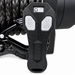 Close-up of a black remote control with IN and OUT buttons, displayed against the coiled synthetic rope of the Sherpa 4x4 Black Edition ‘Stallion’ 25,000Lb Winch—perfect for demanding heavy recovery situations.