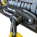 Black rubber Sherpa 4x4 Winch Cable Stopper / Up to 12.7mm mounted on a fairlead with a yellow strap attached, serving as a durable winch rope protector.