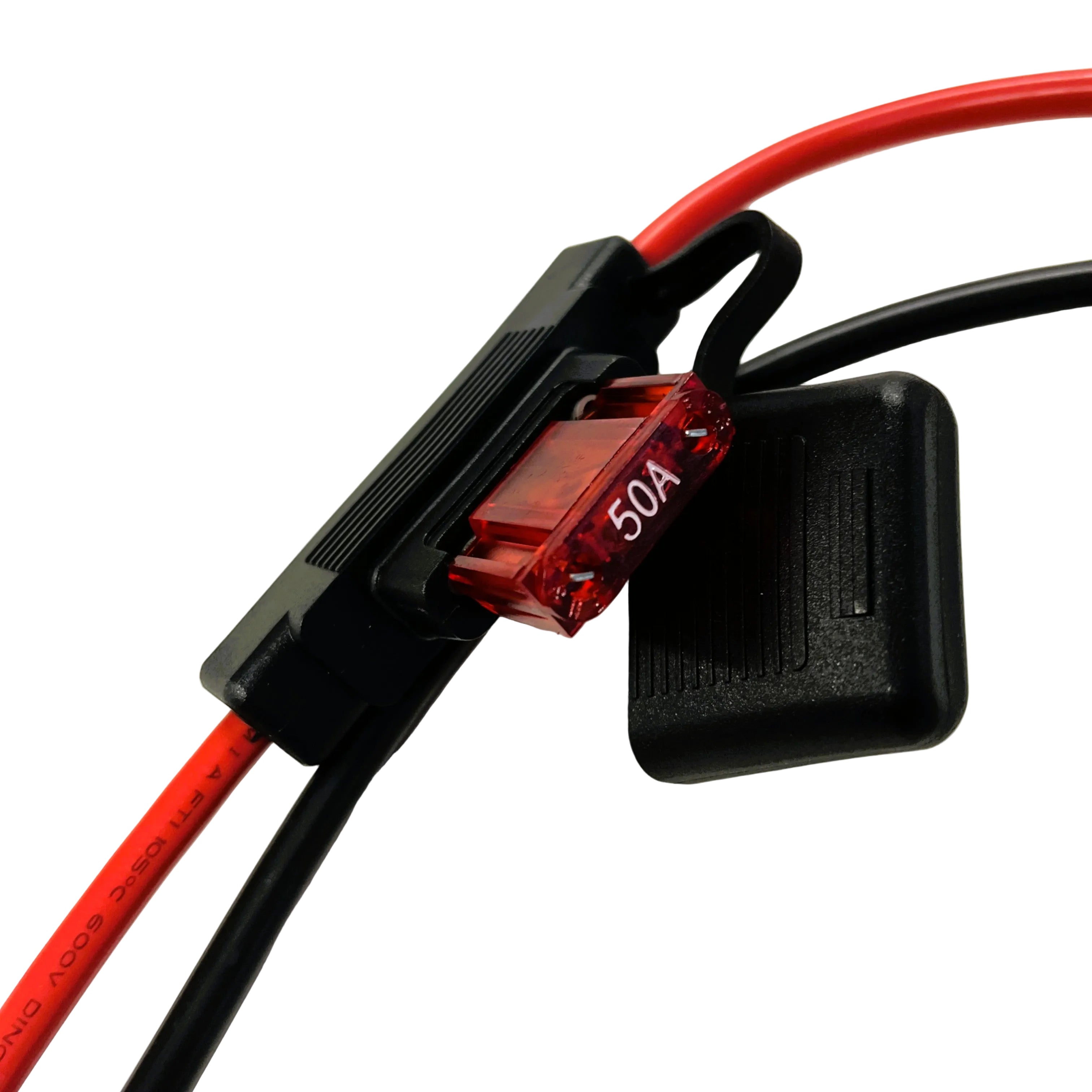 A close-up of a red 15A automotive blade fuse in a black fuse holder connected to red and black electrical wires, as typically seen in setups using the Trolltek™ 12V LiFePO4 Lithium Slimline Battery 4WD Bundle – Charge While Driving (DC) by Trolltek, alongside a DC/DC charger with MPPT solar regulator.