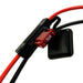 A close-up of a red 15A automotive blade fuse in a black fuse holder connected to red and black electrical wires, as typically seen in setups using the Trolltek™ 12V LiFePO4 Lithium Slimline Battery 4WD Bundle – Charge While Driving (DC) by Trolltek, alongside a DC/DC charger with MPPT solar regulator.