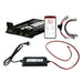 On a white background, the Trolltek™ 12V LiFePO4 Lithium Slimline Battery AC Bundle – Charge From 240V Power (AC) by Trolltek is displayed alongside a smartphone showing battery stats, app cables, charger, and power cord.